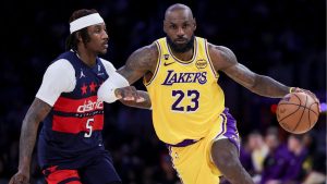 Los Angeles Lakers forward LeBron James, right, drives against Washington Wizards guard Jamir Watkins during the second half of an NBA basketball game Monday, March 30, 2026, in Los Angeles. (Ryan Sun/AP Photo)
