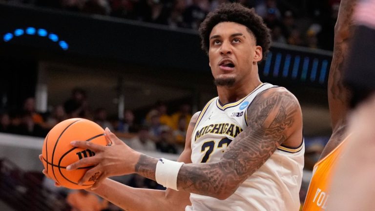 Michigan's Yaxel Lendeborg (23) heads to the basket during the first half in the Elite Eight of the NCAA college basketball tournament against Tennessee, Sunday, March 29, 2026, in Chicago. (Nam Y. Huh/AP Photo)
