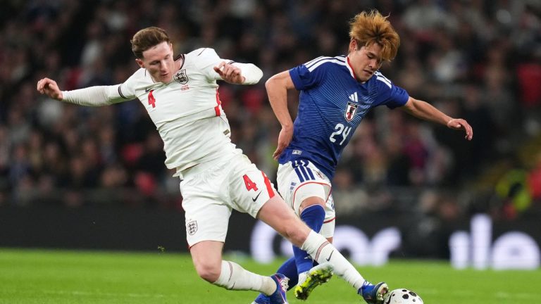 England's Elliot Anderson, left, and Japan's Kaishu Sano challenge for the ball during the International friendly soccer match between England and Japan in London, Tuesday, March 31, 2026. (Kirsty Wigglesworth/AP)