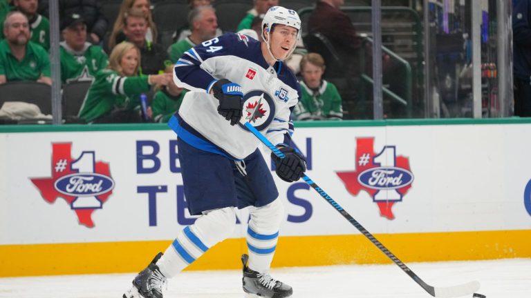Winnipeg Jets defenseman Logan Stanley skates with the puck against the Dallas Stars during the first period of an NHL hockey game Monday, Feb. 2, 2026, in Dallas. (Julio Cortez/AP)