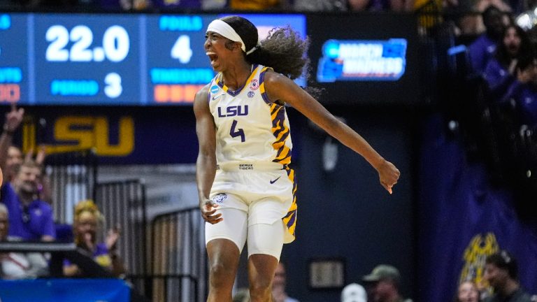 LSU guard Flau'jae Johnson (4) celebrates against Texas Tech during the second half in the second round of the NCAA college basketball tournament, Sunday, March 22, 2026, in Baton Rouge, La. (Gerald Herbert/AP)