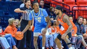 Long Island's Malachi Davis looks to pass as Kylan Boswell defends an NCAA college basketball game against Illinois Saturday, Nov. 22, 2025, in Champaign, Ill. (Craig Pessman/AP Photo)