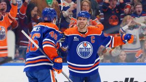 Edmonton Oilers’ Connor McDavid (97) celebrates a goal with Max Jones (46) during second period NHL action, in Edmonton on Saturday March 28, 2026. (James Maclennan/THE CANADIAN PRESS)