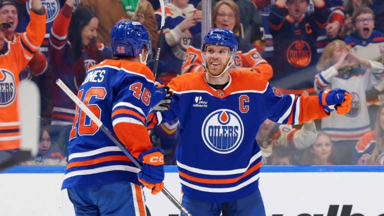 Edmonton Oilers’ Connor McDavid (97) celebrates a goal with Max Jones (46) during second period NHL action, in Edmonton on Saturday March 28, 2026. (James Maclennan/THE CANADIAN PRESS)