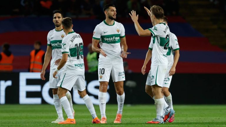 Elche's Rafa Mir, center, celebrates after scoring his side's opening goal during a Spanish La Liga soccer match between FC Barcelona and Elche CF in Barcelona, Spain, Sunday, Nov. 2, 2025. (Joan Monfort/AP)