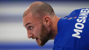 Italy's Amos Mosaner competes against Italy during the semi-finals round of the mixed doubles curling match, at the 2026 Winter Olympics, in Cortina d'Ampezzo, Italy, Monday, Feb. 9, 2026. (Fatima Shbair/AP Photo)
