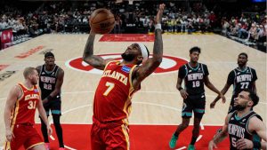 Atlanta Hawks guard Nickeil Alexander-Walker (7) scores against the Memphis Grizzlies during the first half of an NBA basketball game, Monday, March 23, 2026, in Atlanta. (Mike Stewart/AP Photo)