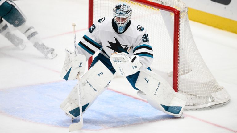 San Jose Sharks goaltender Alex Nedeljkovic (33) watches the puck during the third period of an NHL hockey game against the Washington Capitals, Thursday, Jan. 15, 2026, in Washington. (Nick Wass/AP)