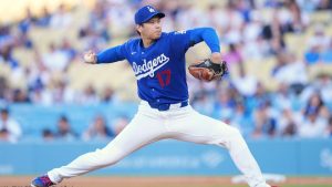 Los Angeles Dodgers pitcher Shohei Ohtani throws to the plate during the third inning of a preseason baseball game against the Los Angeles Angels, Tuesday, March 24, 2026, in Los Angeles. (Mark J. Terrill/AP Photo)