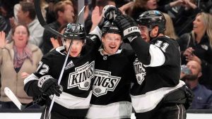 Los Angeles Kings defenseman Mikey Anderson, center, celebrates his goal with left wing Artemi Panarin, left, and center Anze Kopitar during the second period of an NHL hockey game against the New York Islanders. (Mark J. Terrill/AP)