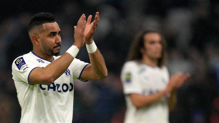 Marseille's Dimitri Payet applauds at the end of the French League One soccer match between Marseille and Paris Saint-Germain at the Velodrome stadium in Marseille, southern France, Sunday, Feb. 26, 2023. (Daniel Cole/AP)