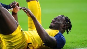 Union SG's Promise David grimaces in pain during a Champions League opening phase soccer match between PSV and Union SG, at the PSV stadium in Eindhoven, Netherlands, Tuesday, Sept. 16, 2025. (Peter Dejong/AP)