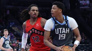 Utah Jazz guard Ace Bailey (19) looks for a play against Toronto Raptors forward Collin Murray-Boyles (12) during the first half of an NBA basketball game, Monday, March 23, 2026, in Salt Lake City. (Rob Gray/AP Photo)
