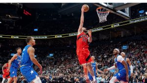 Toronto Raptors forward Sandro Mamukelashvili (54) scores between the Orlando Magic defence during first half NBA action in Toronto on Sunday, March 29, 2026. (Frank Gunn/THE CANADIAN PRESS)