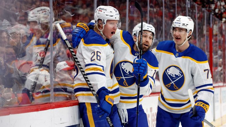 Buffalo Sabres' Rasmus Dahlin (26) celebrates his goal with teammates Jason Zucker (17) and Ryan McLeod (71) during the first period of an NHL hockey game against the Carolina Hurricanes in Raleigh, N.C., Monday, Jan. 19, 2026. (Karl DeBlaker/AP)