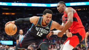 Detroit Pistons forward Tobias Harris (12) controls the ball as Toronto Raptors forward RJ Barrett (9) defends during second half NBA basketball action in Toronto on Sunday, March 15, 2026. (Frank Gunn/CP)