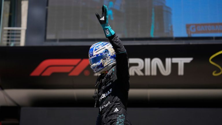 Mercedes driver George Russell of Britain waves after winning the Sprint Race of the Chinese Formula One Grand Prix at the Shanghai International Circuit, in Shanghai, China, Saturday, March 14, 2026. (Andy Wong/AP Photo)