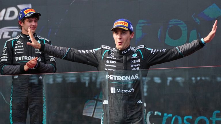 Mercedes driver George Russell of Britain celebrates on the podium after winning the Australian Formula One Grand Prix with second placed teammate Andrea Kimi Antonelli, left, of Italy at Albert Park, in Melbourne, Australia, Sunday, March 8, 2026. (Scott Barbour/AP)