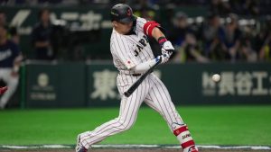 Japan's Seiya Suzuki hits a two-run home run during the first inning of a World Baseball Classic game between Japan and South Korea on Saturday, March 7, 2026 in Tokyo, Japan. (AP/Hiro Komae)