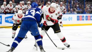 Ottawa Senators left wing Brady Tkachuk (7) shoots in front of Tampa Bay Lightning defenseman Darren Raddysh (43) during the third period of an NHL hockey game Thursday, Oct. 9, 2025, in Tampa, Fla. (Chris O'Meara/AP)