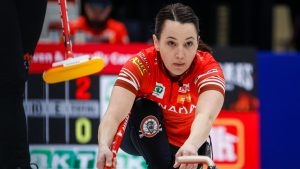 Team Canada third Val Sweeting delivers a stone against Denmark at the World Women’s Curling Championship in Calgary, Monday, March 16, 2026. (Jeff McIntosh/CP)
