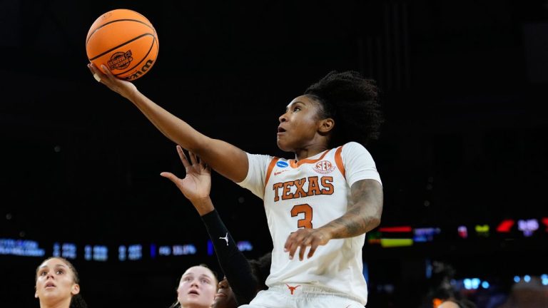 Texas guard Rori Harmon (3) drives to the basket against Michigan during the first half in the Elite Eight of the NCAA college basketball tournament, Monday, March 30, 2026, in Fort Worth, Texas. (Tony Gutierrez/AP Photo)