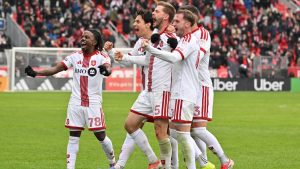 Toronto FC defender Walker Zimmerman, centre, celebrates with teammates after scoring the go ahead goal against the Columbus Crew during second half MLS soccer action in Toronto on Saturday, March 21, 2026. (Jon Blacker/CP)