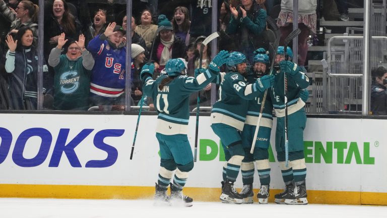 Seattle Torrent forward Jessie Eldridge, second from right, celebrates scoring a goal against the Toronto Sceptres with defender Emily Brown (11), defender Mariah Keopple (20) and forward Julia Gosling, right, during the third period of a PWHL hockey game, Tuesday, Jan. 20, 2026, in Seattle. (Lindsey Wasson/AP)