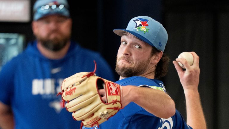 Toronto Blue Jays pitcher Trey Yesavage throws a bullpen session as manager John Schneider watches at Spring Training in Dunedin, Fla. on Wednesday Feb. 11, 2026. (Frank Gunn/CP)