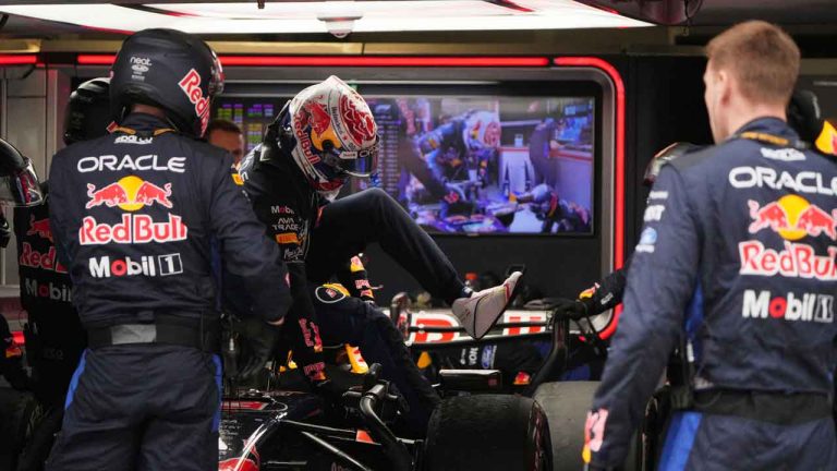 Red Bull driver Max Verstappen of the Netherlands gets out of his car in the garage after retiring from the Chinese Formula One Grand Prix race at the Shanghai International Circuit. (Andy Wong/AP)