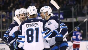 Winnipeg Jets center Gabriel Vilardi, right, celebrates with teammates after scoring on a power play during the second period of an NHL hockey game against the New York Rangers. (Heather Khalifa/AP)