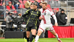 Columbus Crew forward Wessam Abou Ali, 9, fights for the ball against Toronto FC defender Walker Zimmerman, 25, during first half MLS soccer action in Toronto on Saturday, March 21, 2026. (Jon Blacker/CP)