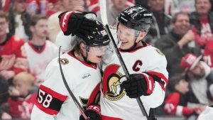 Ottawa Senators left wing Brady Tkachuk, right, celebrates his goal with Carter Yakemchuk, left, against the Detroit Red Wings in the first period of an NHL hockey game Tuesday, March 24, 2026, in Detroit. (Paul Sancya/AP Photo)