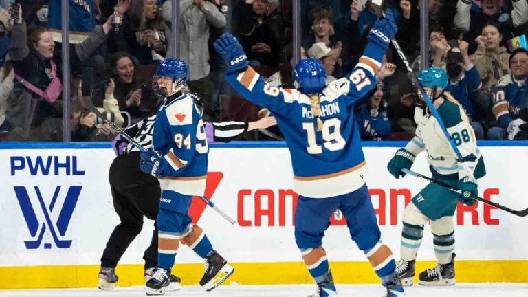 Vancouver Goldeneyes' Anna Meixner (94) celebrates her goal with Mannon McMahon (19) as Seattle Torrent's Julia Gosling (88) skates to the bench during the second period of a PWHL hockey game in Vancouver, on Tuesday, April 14, 2026. (Ethan Cairns/CP)