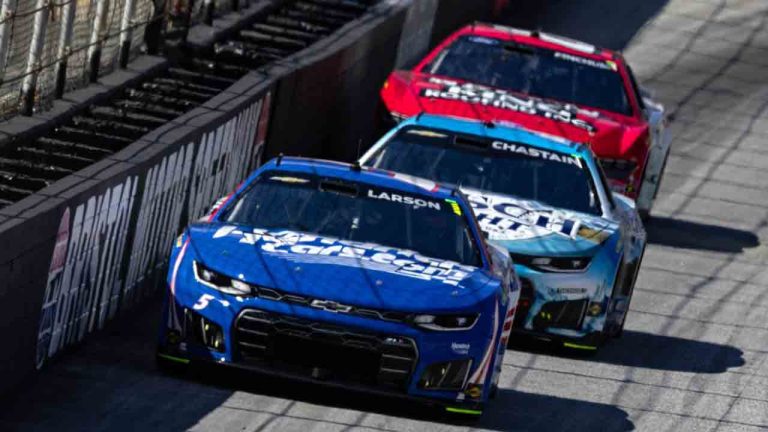 Kyle Larson (5) leads Ross Chastain during a NASCAR Cup Series auto race, Sunday, April 12, 2026, in Bristol, Tenn. (AP Photo/Wade Payne)