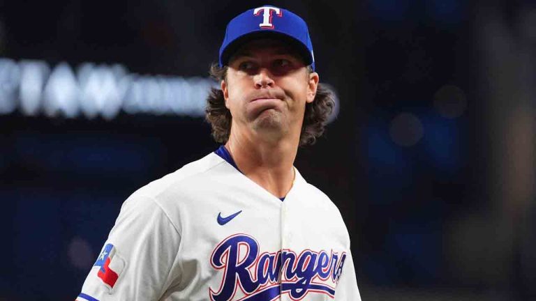 Texas Rangers starting pitcher Jacob deGrom reacts after pitching to the Seattle Mariners during the fourth inning of a baseball game Monday, April 6, 2026, in Arlington, Texas. (Julio Cortez/AP)
