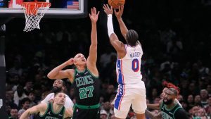 Philadelphia 76ers guard Tyrese Maxey (0) takes a shot over Boston Celtics guard Jordan Walsh (27) during the first half of Game 5 of a first-round NBA playoffs basketball series, Tuesday, April 28, 2026, in Boston. (Charles Krupa/AP)