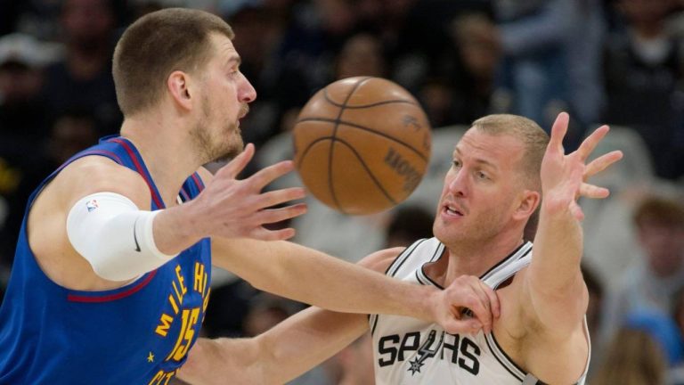 Denver Nuggets centre Nikola Jokic (15) passes as he is guarded by San Antonio Spurs center Mason Plumlee during the first half of an NBA basketball game, Sunday, April 12, 2026, in San Antonio. (Darren Abate/AP)
