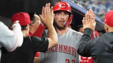 Reds chase Alcantara in 9th, beat Marlins in extras