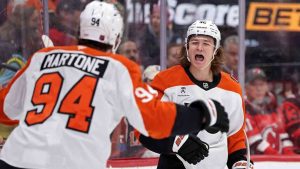 Philadelphia Flyers center Trevor Zegras (46) is congratulated by Porter Martone after scoring his second goal of the game during the first period of an NHL hockey game against the New Jersey Devils, Tuesday, April 7, 2026, in Newark, N.J. (Adam Hunger/AP)