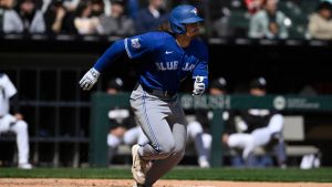 Toronto Blue Jays' Addison Barger runs to first base while flying out during the sixth inning of a baseball game against the Chicago White Sox in Chicago, Sunday, April 5, 2026. (Paul Beaty/AP)