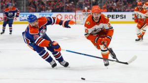 Anaheim Ducks' Chris Kreider (20) battles against Edmonton Oilers' Darnell Nurse (25) during first period first round Game 5 NHL playoff action in Edmonton on Tuesday, April 28, 2026. (Codie McLachlan/CP)