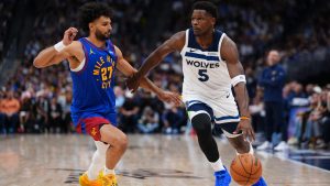 Minnesota Timberwolves guard Anthony Edwards (5) drives to the basket against Denver Nuggets guard Jamal Murray (27) during the second half in Game 2 of a first-round NBA playoffs basketball series Monday, April 20, 2026, in Denver. (Jack Dempsey/AP)