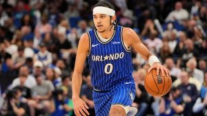 Orlando Magic guard Anthony Black (0) moves the ball against the Detroit Pistons an NBA basketball game, Monday, April 6, 2026, in Orlando, Fla. (AP Photo/John Raoux)