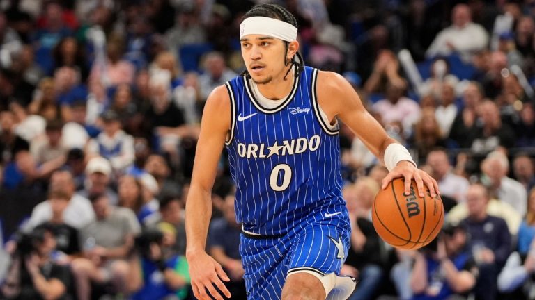 Orlando Magic guard Anthony Black (0) moves the ball against the Detroit Pistons an NBA basketball game, Monday, April 6, 2026, in Orlando, Fla. (AP Photo/John Raoux)