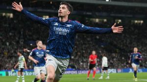 Arsenal's Kai Havertz celebrates after scoring his sides first goal during the Champions League quarterfinals, first leg, soccer match between Sporting CP and Arsenal, in Lisbon, Tuesday, April 7, 2026. (Armando Franca/AP)