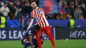 Atletico Madrid's Alex Baena comforts Barcelona's Lamine Yamal after the Champions League quarterfinal first leg soccer match between Barcelona and Atletico Madrid in Barcelona, Spain, Wednesday, April 8, 2026. (AP Photo/Joan Monfort)
