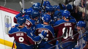 Colorado Avalanche centre Nicolas Roy (10) is congratulated by teammates after scoring the game winning goal against the Los Angeles Kings in overtime of Game 2 in the first round of the NHL hockey Stanley Cup playoffs, Tuesday, April 21, 2026, in Denver. (Jack Dempsey/AP)