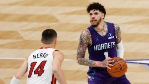 Charlotte Hornets guard LaMelo Ball (1) looks to shoot against Miami Heat guard Tyler Herro during the second half of an NBA basketball game, Tuesday, March 17, 2026, in Charlotte, N.C. (Nell Redmond/AP)