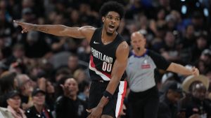 Portland Trail Blazers guard Scoot Henderson (00) celebrates a score against the San Antonio Spurs during the second half in Game 2 of a first-round NBA playoffs basketball series in San Antonio, Tuesday, April 21, 2026. (AP Photo/Eric Gay)